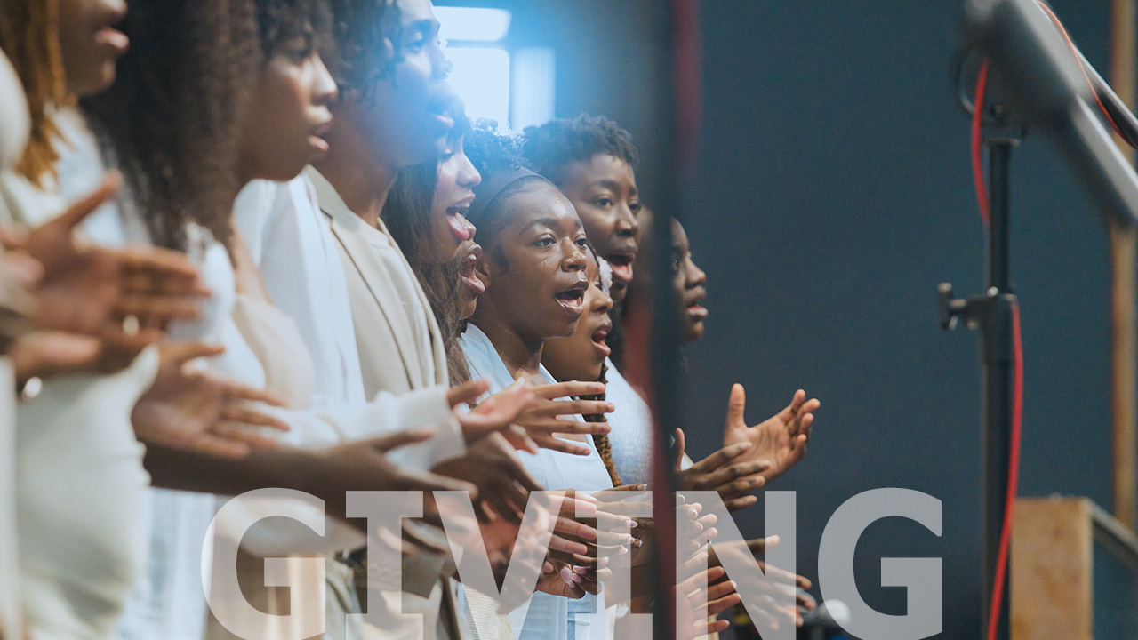 Choir singing together in white